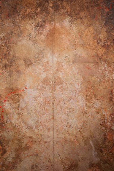 Kreative, rostrote Textur mit abstrakten Mustern und leichten Farbspritzern.